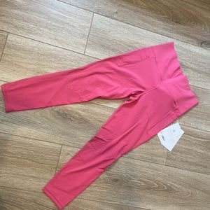 Athleta Salutation Stash pocket II 7/8 tight